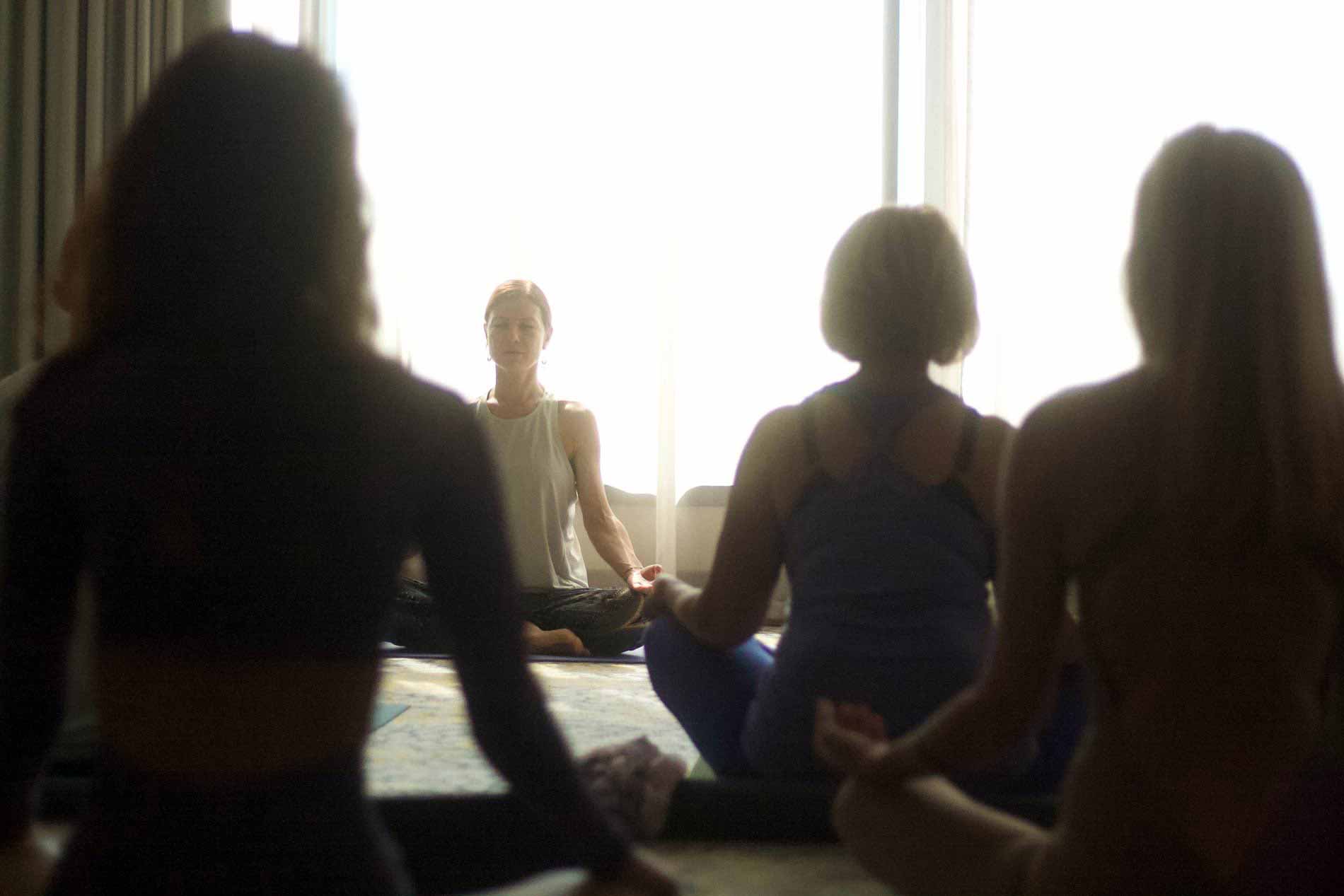 People seated in a circle during a Soul Truth Collective gathering